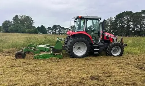 Mel-Ray Industries Tractor slashing grass at Freemans Reach Nsw